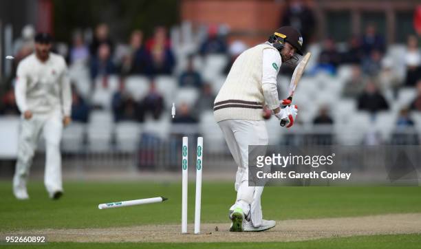 Mark Stoneman of Surrey is bowled by Graham Onions of Lancashire during the Specsavers County Championship Division One match between Lancashire and...