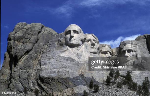Mount Rushmore National Memorial is a sculpture carved into the granite face of Mount Rushmore, South Dakota, in the United States - It features...