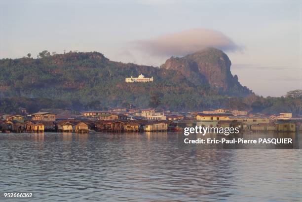 Pirates of the South China Sea And Philippines. At the foot of the mountain covered in lush jungle, the pirates' settlement seems like an ordinary...