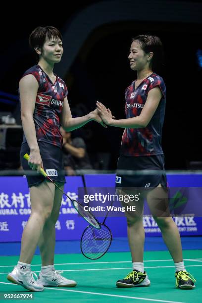 Yuki Fukushima and Sayaka Hirota of Japan reacts during women's doubles final match against Misaki Matsutomo and Ayaka Takahashi of Japan at the 2018...