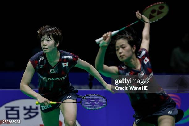 Yuki Fukushima and Sayaka Hirota of Japan hits a return during women's doubles final match against Misaki Matsutomo and Ayaka Takahashi of Japan at...