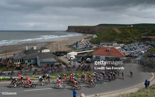 Professional riders in the peloton climb up Saltburn bank as they ride the first of three circuits as they compete in the East Cleveland Klondike...