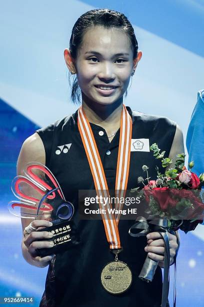 Tai Tzu-ying of Chinese Taipei pose gold medals on the podium after winning the women's singles final match against Chen Yufei of China at the 2018...