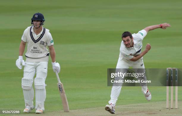 Hilton Cartwright of Middlesex and Lukas Carey of Glamorgan during day three of the Specsavers County Championship Division Two match between...