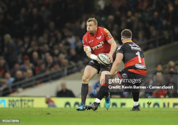 Scarlets' Hadleigh Parkes under pressure from Dragons' Thomas Davies during the Guinness PRO14 Round 21 Judgement Day VI match between Cardiff Blues...