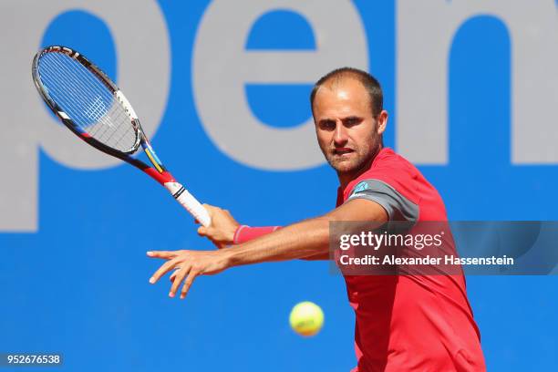 Marius Copil of Rumania plays a fore hand during his qualification match against Andrej Martin of Slovakia on day 2 of the BMW Open at MTTC IPHITOS...