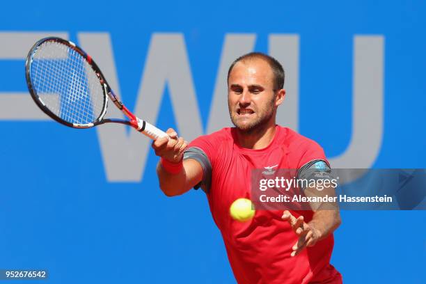 Marius Copil of Rumania plays a fore hand during his qualification match against Andrej Martin of Slovakia on day 2 of the BMW Open at MTTC IPHITOS...