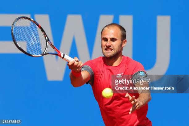 Marius Copil of Rumania plays a fore hand during his qualification match against Andrej Martin of Slovakia on day 2 of the BMW Open at MTTC IPHITOS...
