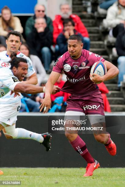 Bordeaux-Begles's Samoan centre Ed Fidow runs with the ball during the French Top 14 rugby union match Bordeaux-Begles vs Racing 92 at the Stade...