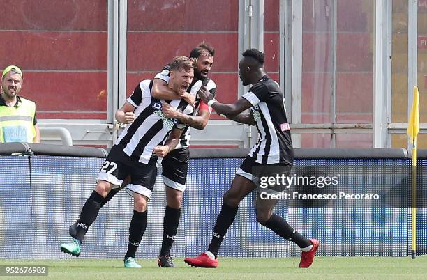 Seko Fofana, Danilo and Silvan Widmer of Udinese Calcio celebrate the 0-1 goal scored by Silvan Widmer during the serie A match between Benevento...
