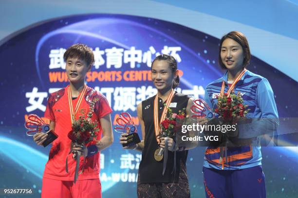 Silver medalist Chen Yufei of China and gold medalist Tai Tzu Ying of Chinese Taipei pose on the podium during women's singles final match on day six...