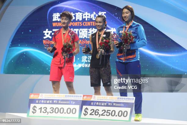 Silver medalist Chen Yufei of China and gold medalist Tai Tzu Ying of Chinese Taipei pose on the podium during women's singles final match on day six...