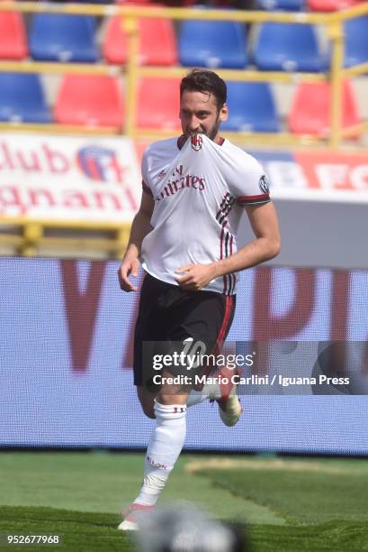 Hakan Calhanoglu of AC Milan celebrates after scoring the opening goal during the serie A match between Bologna FC and AC Milan at Stadio Renato...