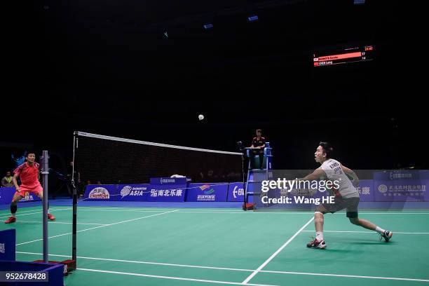 Kento Momota of Japan hits a return during man's singles final match against Chen long of China at the 2018 Badminton Asia Championships on Apirl 29,...