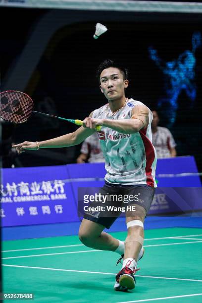 Kento Momota of Japan hits a return during man's singles final match against Chen long of China at the 2018 Badminton Asia Championships on Apirl 29,...