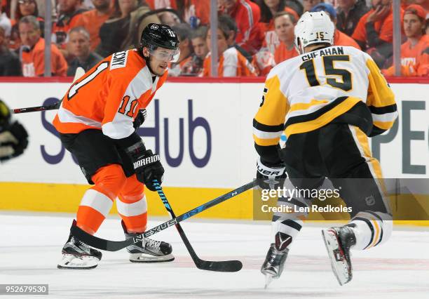 Travis Konecny of the Philadelphia Flyers skates against Riley Sheahan of the Pittsburgh Penguins in Game Six of the Eastern Conference First Round...