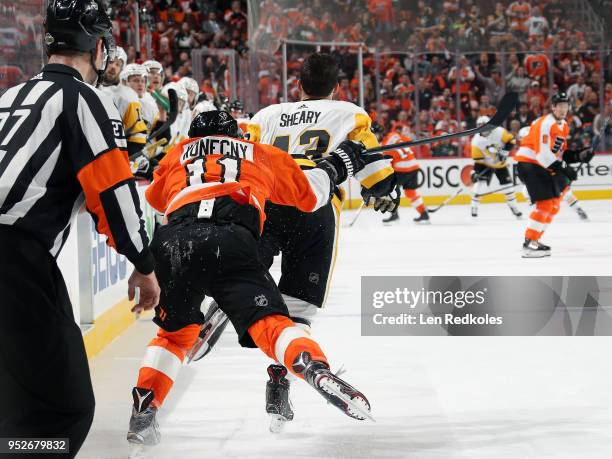 Travis Konecny of the Philadelphia Flyers backchecks Conor Sheary of the Pittsburgh Penguins in Game Six of the Eastern Conference First Round during...