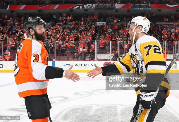 Radko Gudas of the Philadelphia Flyers shakes hands with Patric Hornqvist of the Pittsburgh Penguins after the Penguins defeated the Flyers 8-5 in...