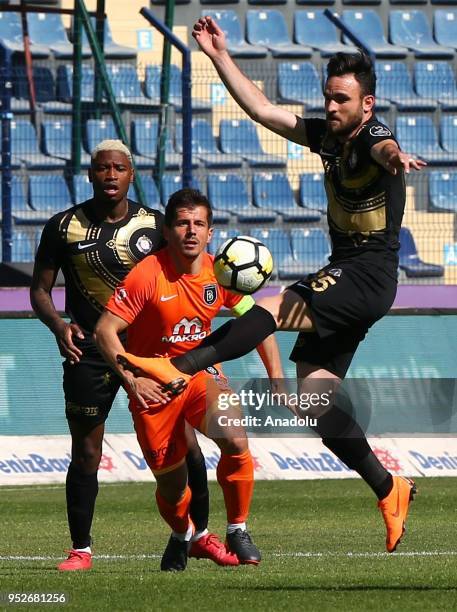 Musa Cagiran of Osmanlispor in action against Emre Belozoglu of Medipol Basaksehir during the Turkish Spor Toto Super Lig soccer match between...