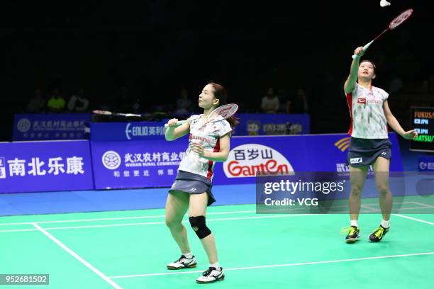 Misaki Matsutomo of Japan and Ayaka Takahashi of Japan compete against Yuki Fukushima of Japan and Sayaka Hirota of Japan during women's doubles...
