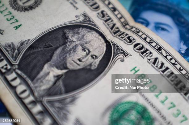 Dollar and British Pound bank notes and are photographed in London on April 29, 2018. The U.S. Benchmark government bond yield broke through the...