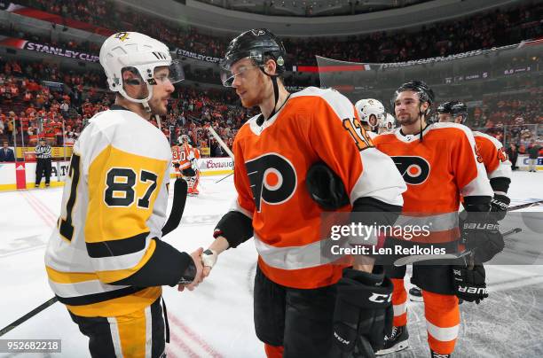 Michael Raffl of the Philadelphia Flyers shakes hands with Sidney Crosby of the Pittsburgh Penguins after the Penguins defeated the Flyers 8-5 in...