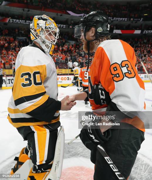 Jakub Voracek of the Philadelphia Flyers shakes hands with Matthew Murray of the Pittsburgh Penguins after the Penguins defeated the Flyers 8-5 in...