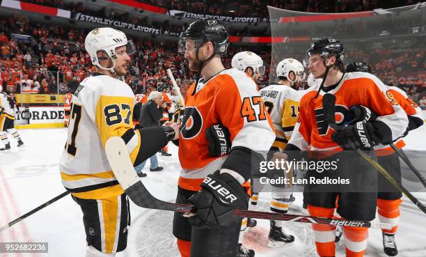 Andrew MacDonald of the Philadelphia Flyers shakes hands with Sidney Crosby of the Pittsburgh Penguins after the Penguins defeated the Flyers 8-5 in...