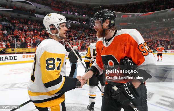 Jakub Voracek of the Philadelphia Flyers shakes hands with Sidney Crosby of the Pittsburgh Penguins after the Penguins defeated the Flyers 8-5 in...