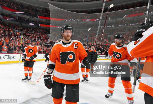 Claude Giroux of the Philadelphia Flyers with teammates salute the crowd after being defeated by the Pittsburgh Penguins 8-5 in Game Six of the...