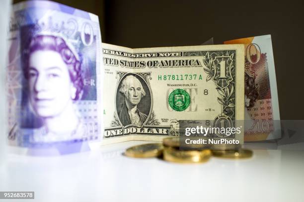 Dollar and British Pound bank notes and are photographed in London on April 29, 2018. The U.S. Benchmark government bond yield broke through the...