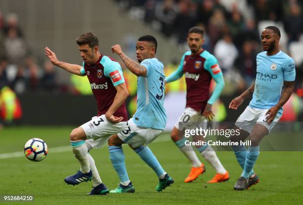 Aaron Cresswell of West Ham United is challenged by Gabriel Jesus of Manchester City during the Premier League match between West Ham United and...