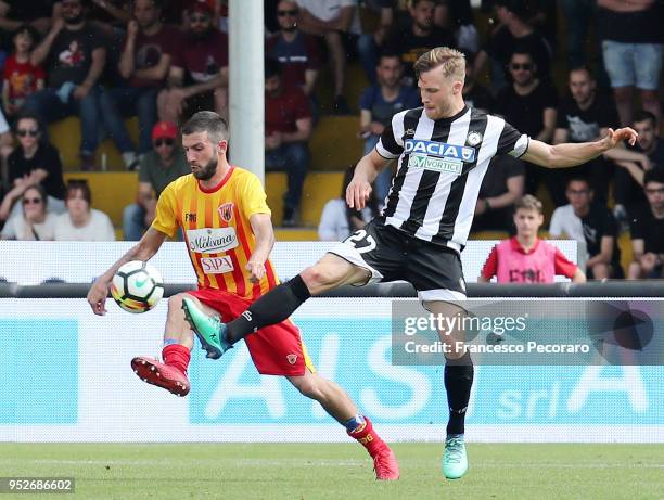 Berat Djimsiti of Benevento Calcio vies with Silvan Widmer of Udinese Calcio during the serie A match between Benevento Calcio and Udinese Calcio at...