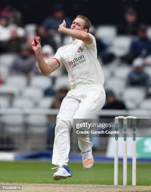 Joe Mennie of Lancashire bowls during the Specsavers County Championship Division One Ãmatch between Lancashire and Surrey at Old Trafford at Old...