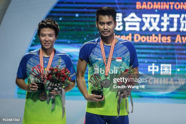 Tontowi Ahmad and Liliyana Natsir of Indonesia pose Silver medals on the podium after runners up the mixed doubles final match against Wang Yulyu and...