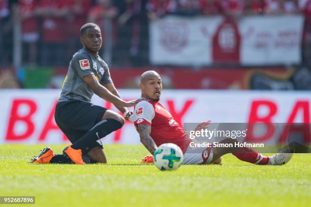 Nigel De Jong of Mainz is challenged by Ademola Lookman of Leipzig during the Bundesliga match between 1. FSV Mainz 05 and RB Leipzig at Opel Arena...