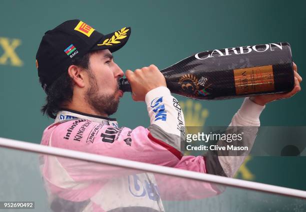 Third place finisher Sergio Perez of Mexico and Force India celebrates on the podium during the Azerbaijan Formula One Grand Prix at Baku City...