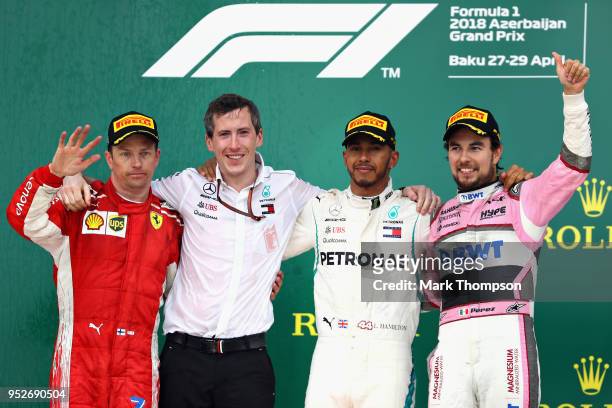 Top three finishers Lewis Hamilton of Great Britain and Mercedes GP, Kimi Raikkonen of Finland and Ferrari and Sergio Perez of Mexico and Force India...