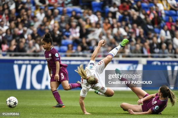 Lyon's French forward Eugenie le Sommer is tackled by Manchester City's British defender Abbie McManus during the UEFA Women's Champions League...