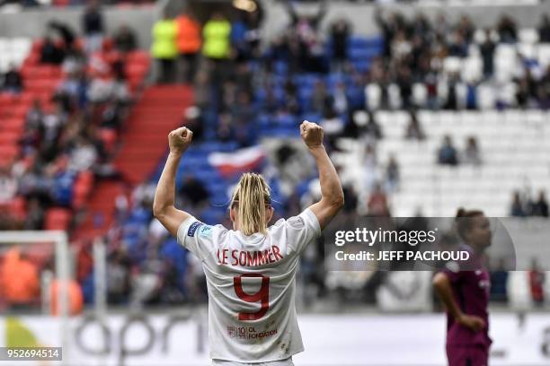 Lyon's French forward Eugenie le Sommer celebrates their victory at the end of the UEFA Women's Champions League semi-final second leg football match...