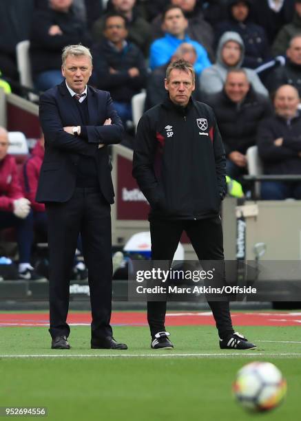 David Moyes Manager of West Ham United and assistant Stuart Pearce during the Premier League match between West Ham United and Manchester City at...