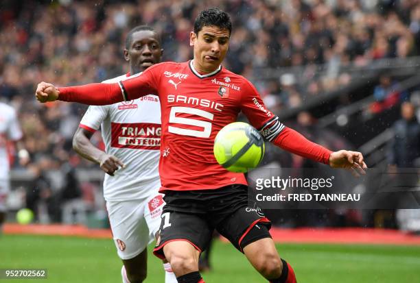 Rennes' French midfielder Benjamin Andre vies with Toulouse's French forward Max Gradel during the French L1 football match Rennes vs Toulouse on...