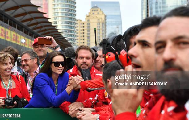 Minttu Virtanen, the wife of Ferrari's Finnish driver Kimi Raikkonen, celebrates his second place after the Formula One Azerbaijan Grand Prix at the...