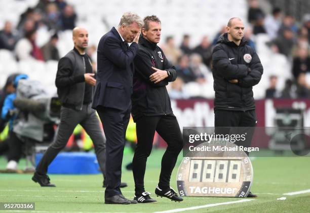 David Moyes, Manager of West Ham United reacts as Stuart Pearce, West Ham United assistant manager looks on during the Premier League match between...