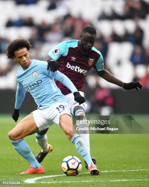 Leroy Sane of Manchester City is challenged by Pedro Obiang of West Ham United during the Premier League match between West Ham United and Manchester...