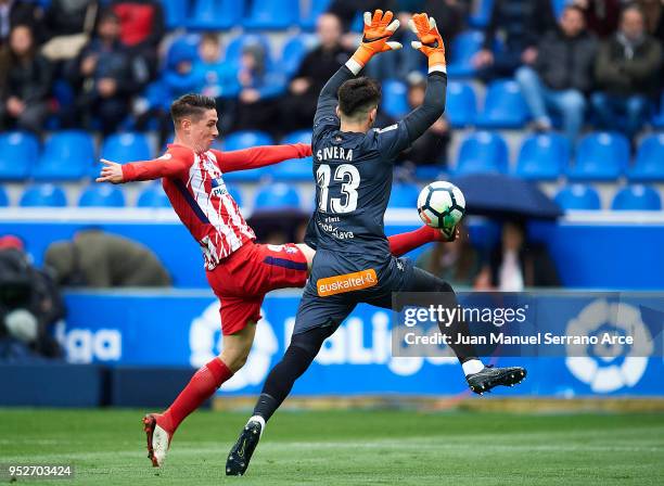 Fernando Torres of Atletico Madrid duels for the ball with Antonio Sivera of Deportivo Alaves during the La Liga match between Deportivo Alaves and...