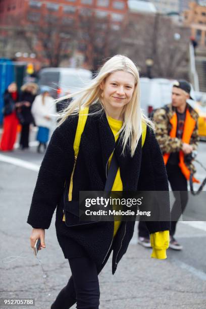 Model Hunter Schafer wears black and yellow on February 9, 2018 in New York City.