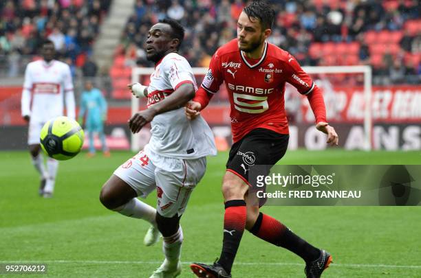 Rennes' French midfielder Jeremy Gelin vies with Toulouse's Congolese forward Firmin Mubele during the French L1 football match Rennes vs Toulouse on...