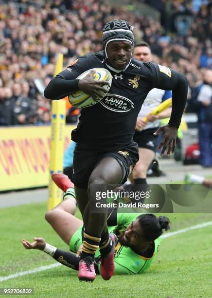 Christian Wade of Wasps breaks clear to score his second try during the Aviva Premiership match between Wasps and Northampton Saints at The Ricoh...