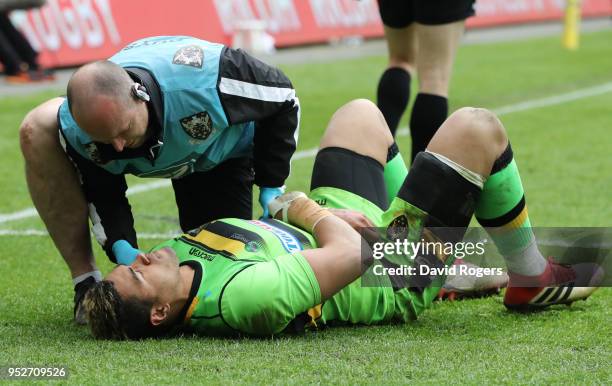 Luther Burrell of Northampton Saints receives treatment from the medical team during the Aviva Premiership match between Wasps and Northampton Saints...